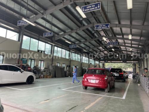 Thủ Tục Đăng Kiểm Ô Tô Mới Và Gia Hạn Đăng Kiểm - Hình 1 Xe ô tô đang được kiểm định tại trung tâm đăng kiểm - 1